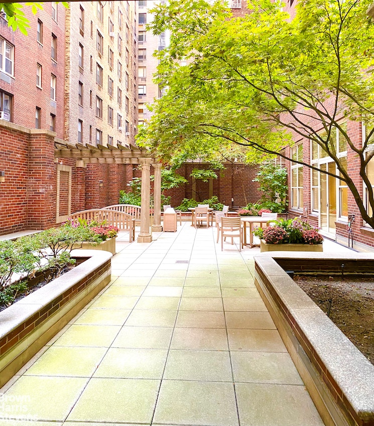 120 East 87th Street, Unit R18H Manhattan, NY 10128 - Photo 11 of 13 a view of swimming pool with outdoor seating