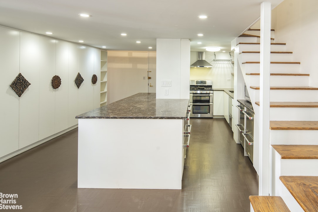 120 East 87th Street, Unit R18H Manhattan, NY 10128 - Photo 5 of 13 a bathroom with a sink a toilet a mirror and shower