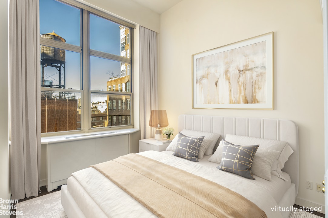 120 East 87th Street, Unit R18H Manhattan, NY 10128 - Photo 6 of 13 a bedroom with a large bed and a window
