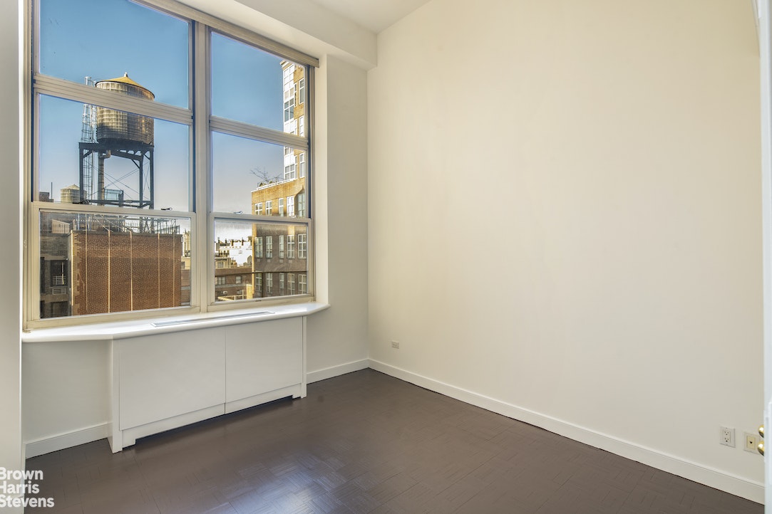 120 East 87th Street, Unit R18H Manhattan, NY 10128 - Photo 7 of 13 an empty room with a window