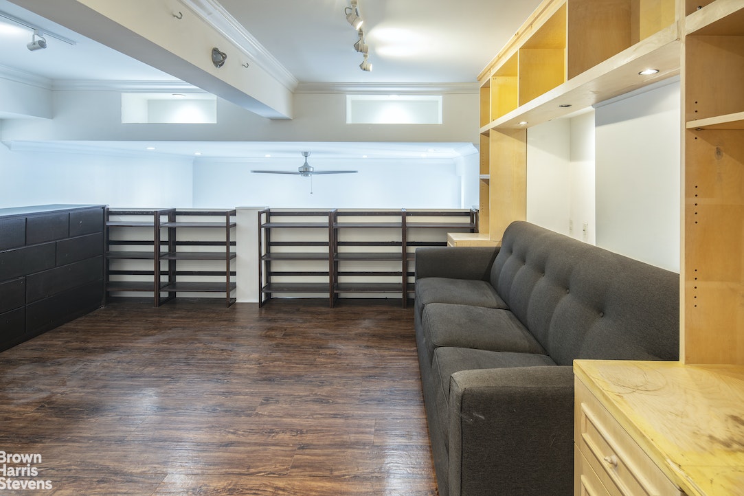 120 East 87th Street, Unit R18H Manhattan, NY 10128 - Photo 9 of 13 a living room with furniture and a flat screen tv