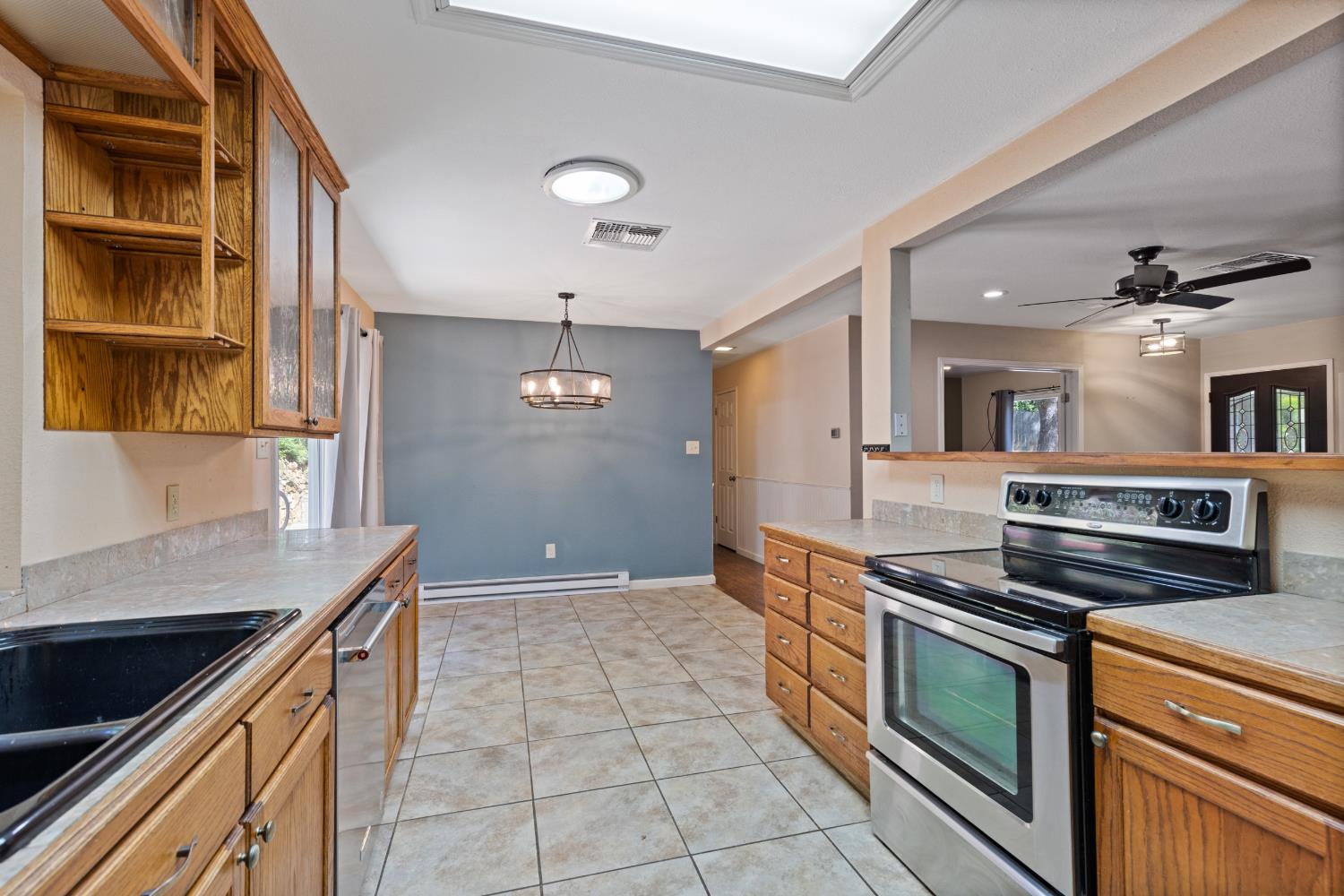 2971 Letitia Avenue Placerville, CA 95667 - Photo 58 of 65 a kitchen with stainless steel appliances granite countertop a stove and a sink