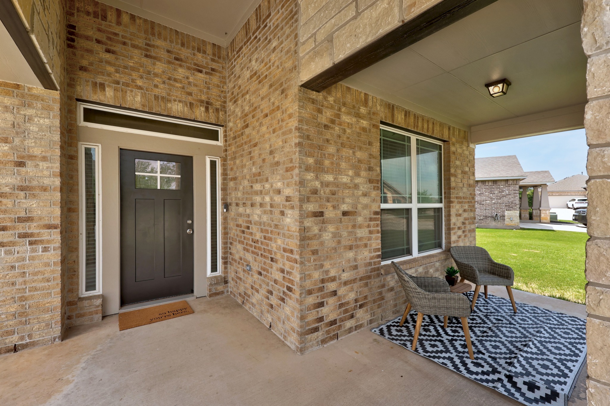 2413 Starhill Ranch Street Georgetown, TX 78628 - Photo 5 of 40 a outdoor space of a house with a garden and outdoor seating