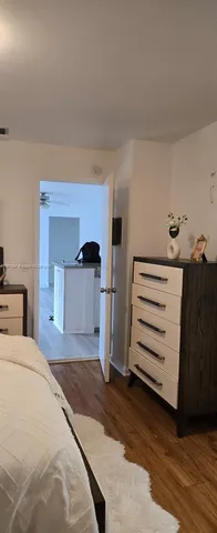 a bedroom with a bed and cabinets