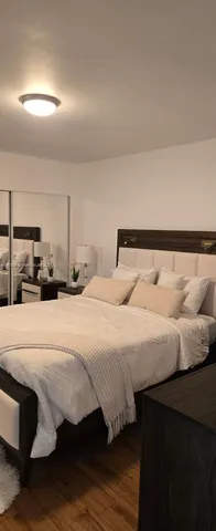 a bedroom with a bed and parked