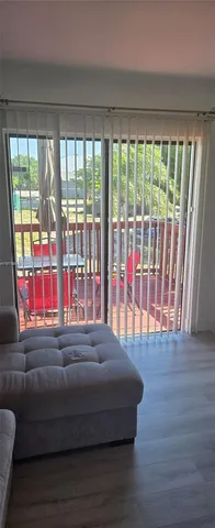 a living room with a balcony