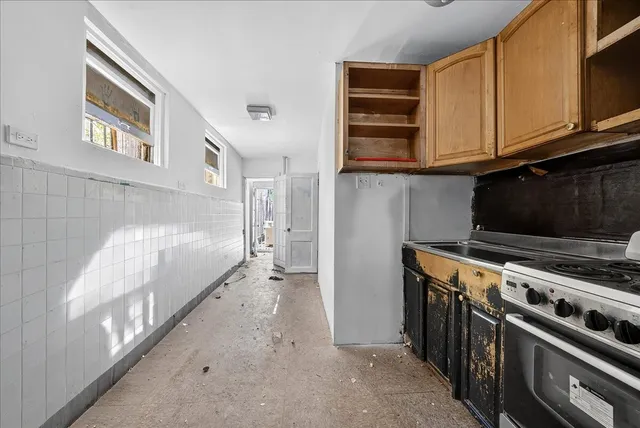 a kitchen with a stove and a microwave