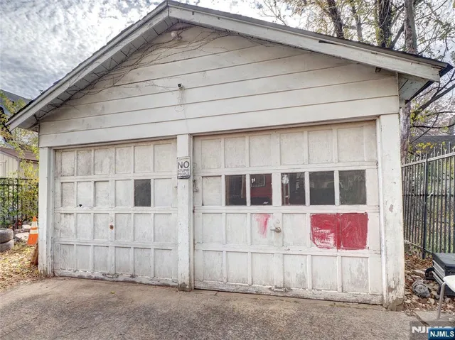 a view of a white house with large windows