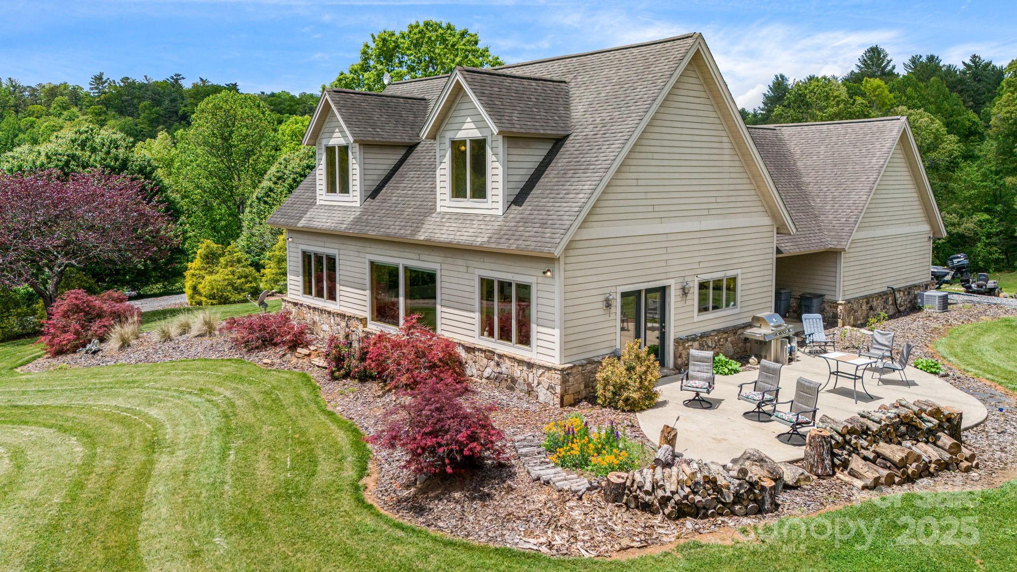 a view of a house with backyard sitting area and garden
