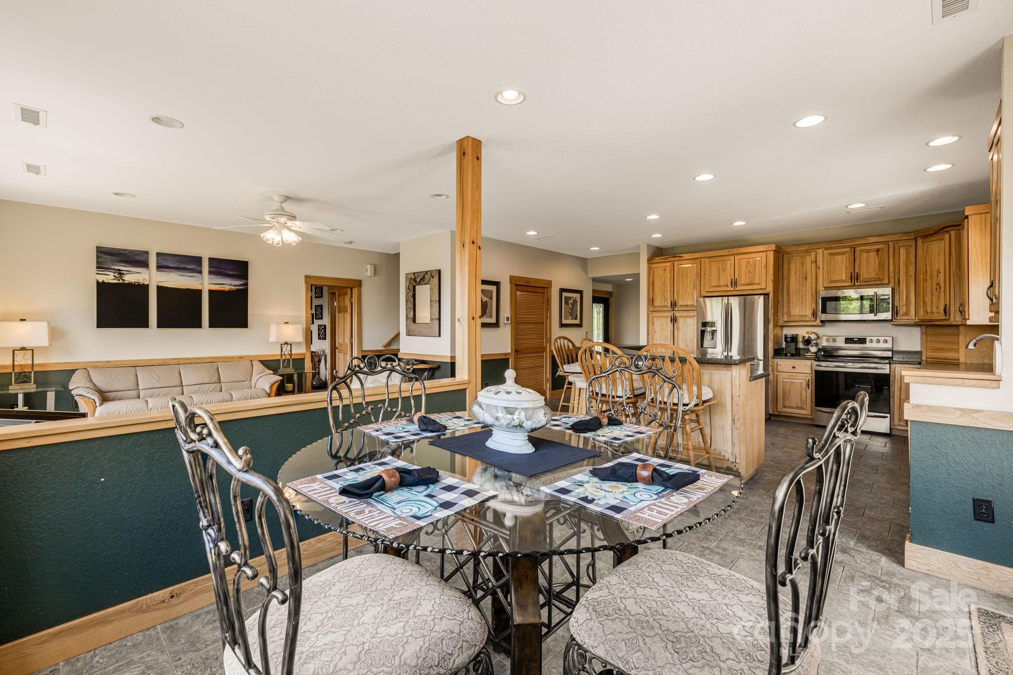 2912 Windswept Ridge Road Marshall, NC 28753 - Photo 14 of 47 a view of a dining table and chairs
