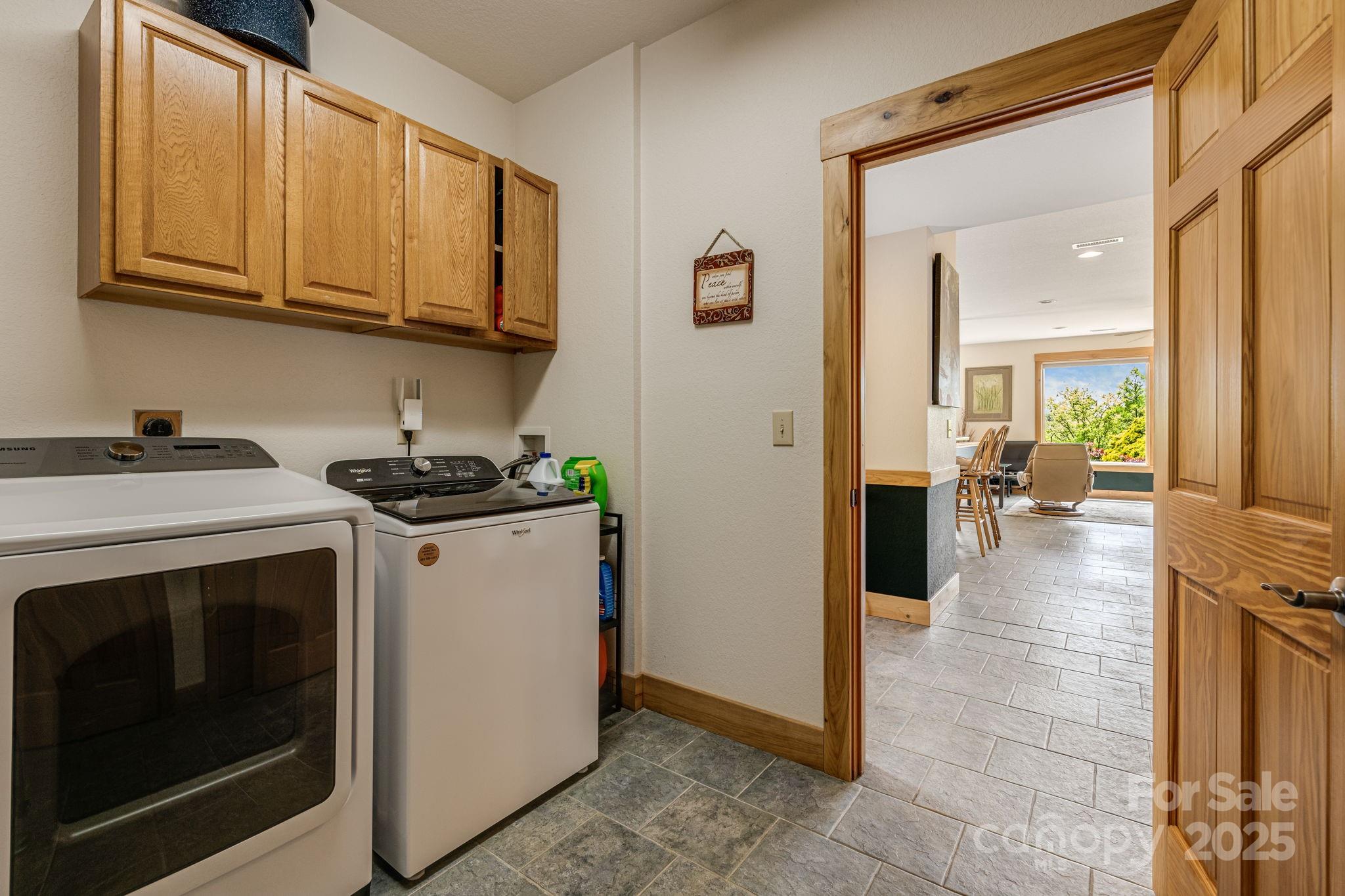 2912 Windswept Ridge Road Marshall, NC 28753 - Photo 17 of 47 a view of a kitchen with fridge and wooden floor