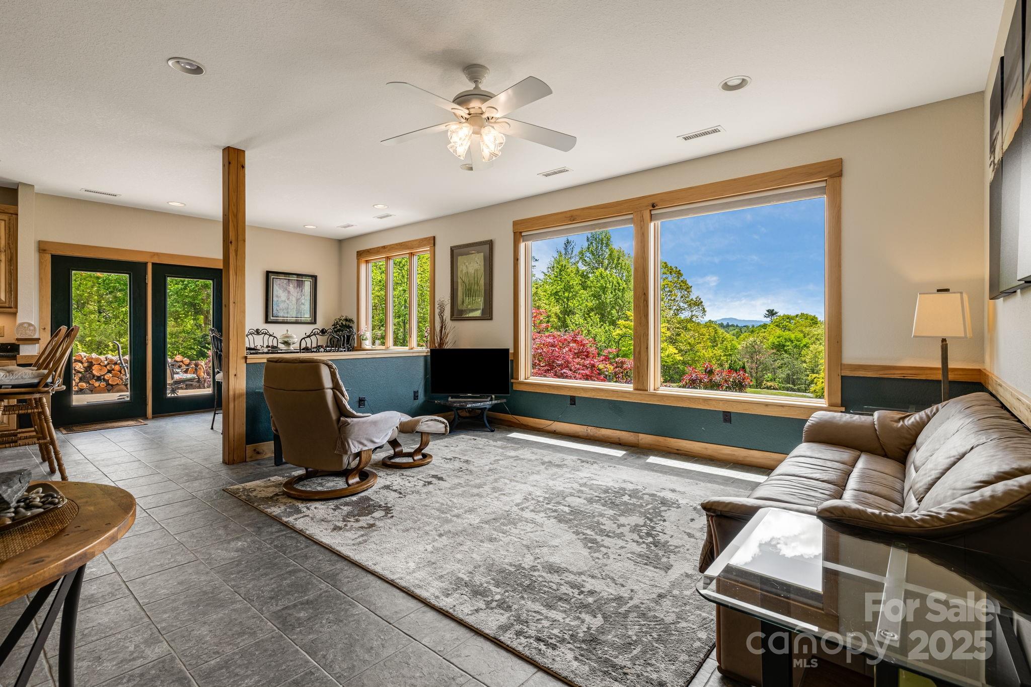 2912 Windswept Ridge Road Marshall, NC 28753 - Photo 8 of 47 a work room with furniture and large windows