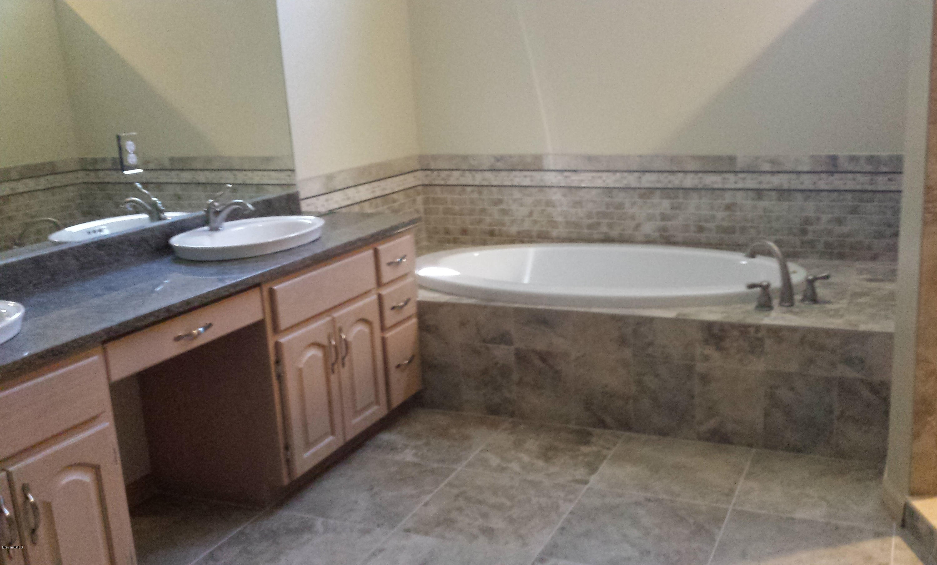 3942 Sparrow Hawk Road Melbourne, FL 32934 - Photo 11 of 12 Updated Master Bath
