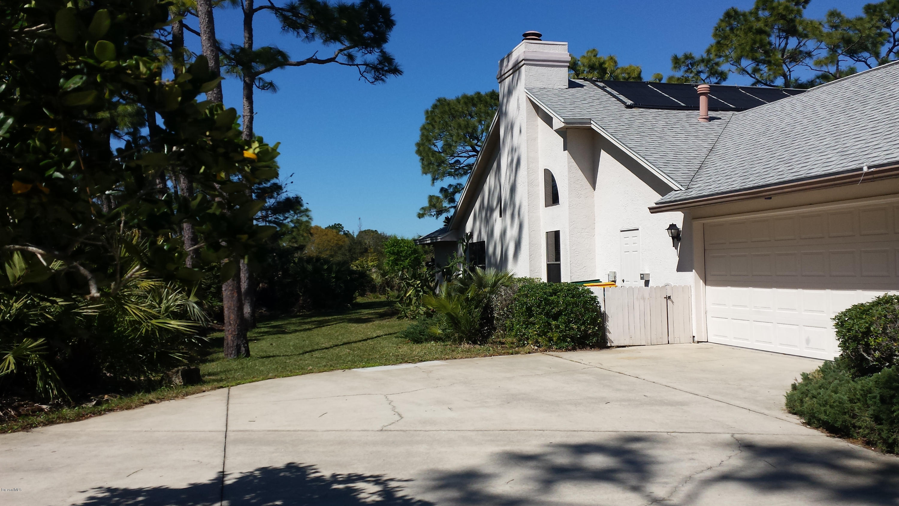 3942 Sparrow Hawk Road Melbourne, FL 32934 - Photo 4 of 12 exterior side