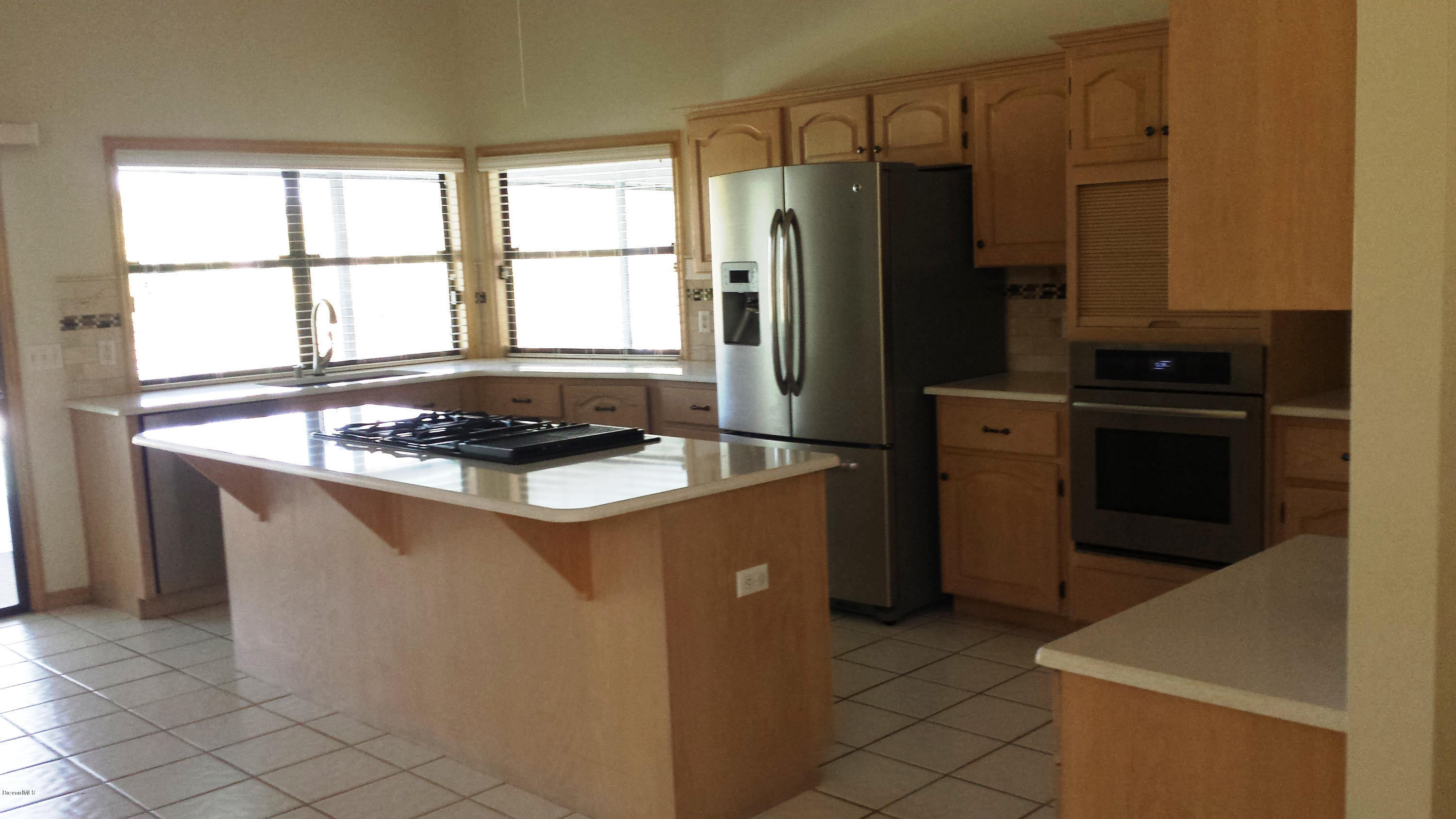 3942 Sparrow Hawk Road Melbourne, FL 32934 - Photo 8 of 12 Spacious Kitchen