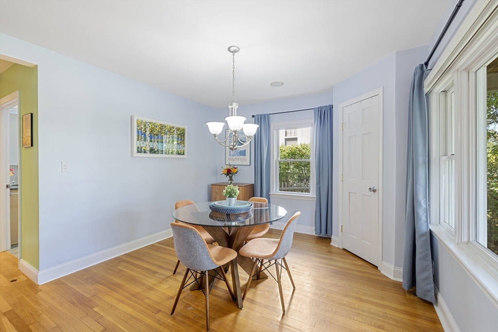 8 Hatch Road Medford, MA 02155 - Photo 12 of 42 a view of a dining room with furniture a chandelier and wooden floor
