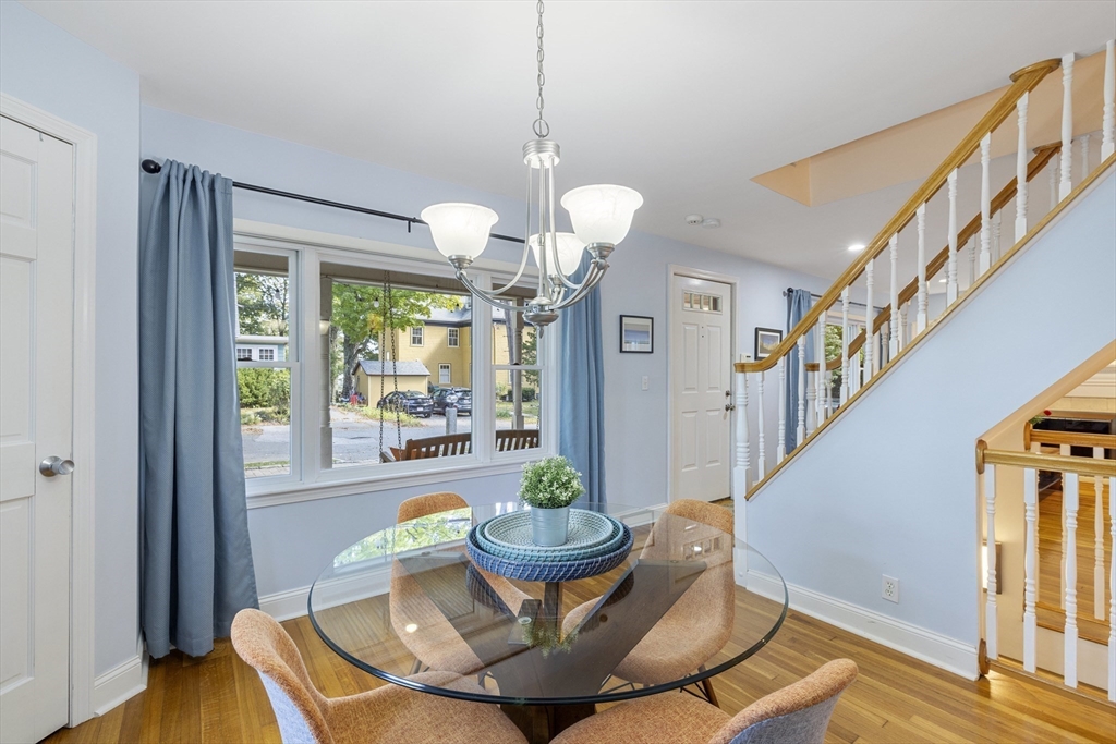 8 Hatch Road Medford, MA 02155 - Photo 13 of 42 a view of a dining room with furniture a chandelier and wooden floor