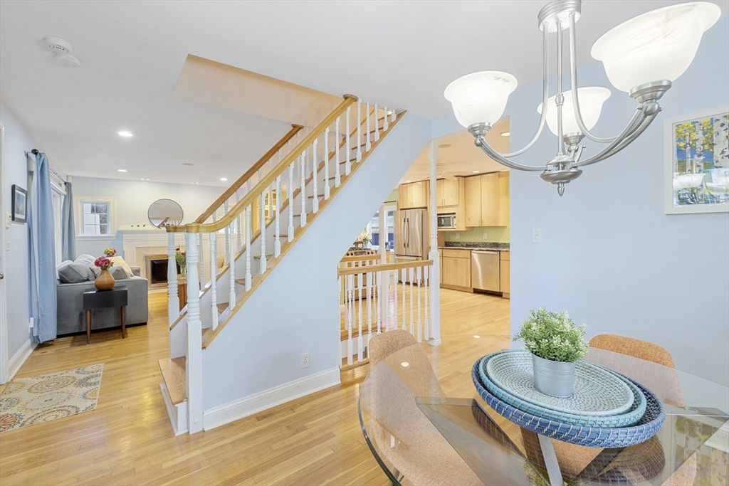 8 Hatch Road Medford, MA 02155 - Photo 14 of 42 a living room with furniture chandelier and a mirror