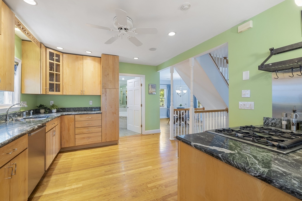 8 Hatch Road Medford, MA 02155 - Photo 18 of 42 a large kitchen with stainless steel appliances granite countertop a stove and a sink