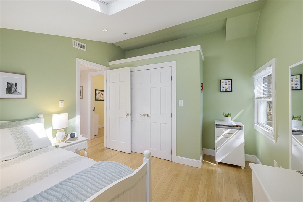 8 Hatch Road Medford, MA 02155 - Photo 26 of 42 a bedroom with a bed and wooden floor