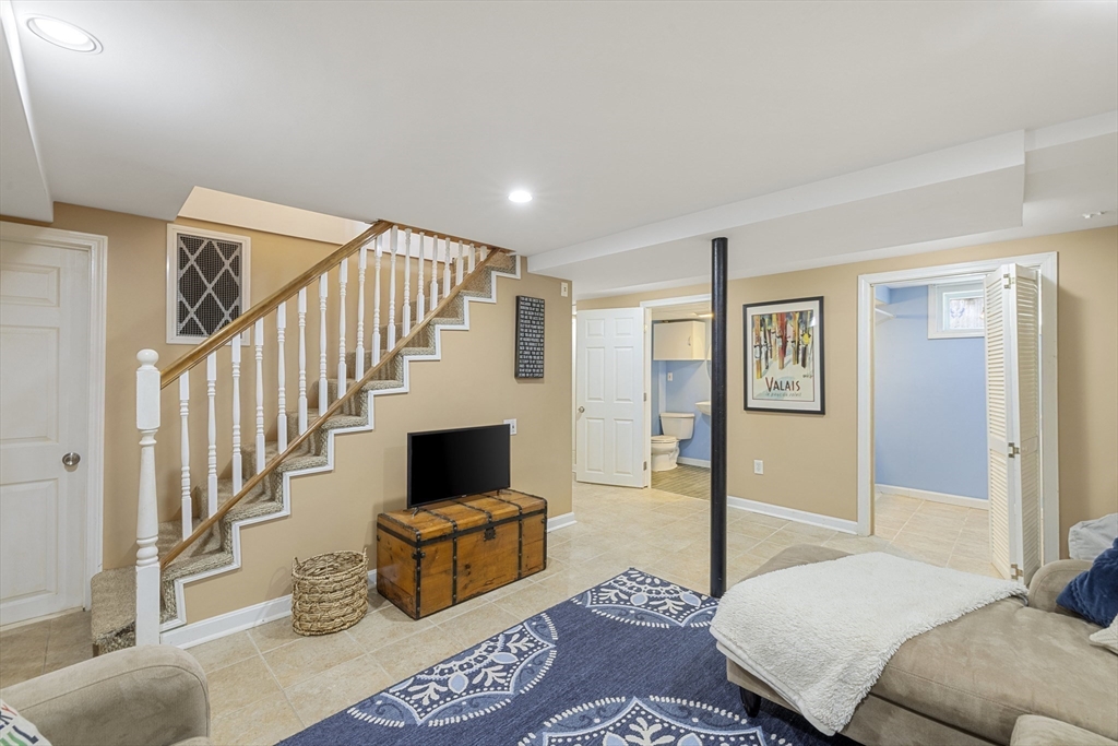 8 Hatch Road Medford, MA 02155 - Photo 29 of 42 a bedroom with a bed and glass door