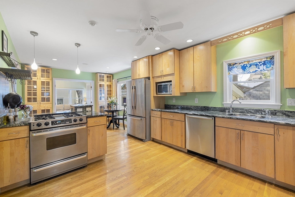 8 Hatch Road Medford, MA 02155 - Photo 3 of 42 a kitchen with stainless steel appliances granite countertop a stove and a sink