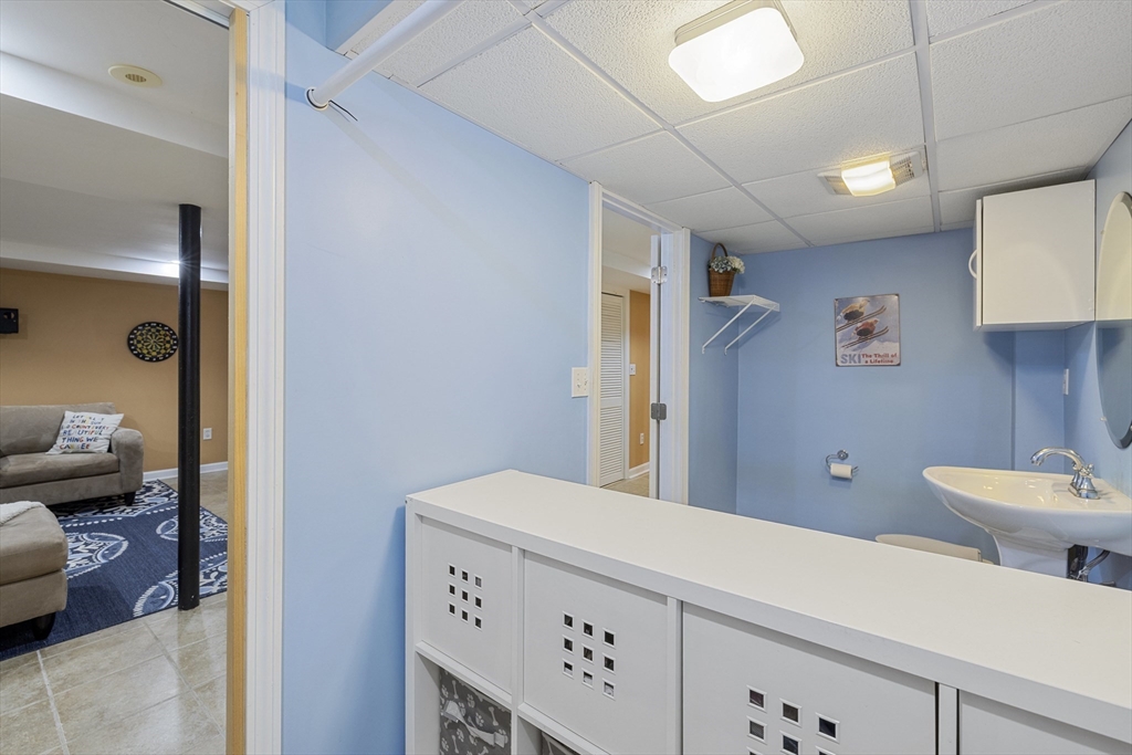 8 Hatch Road Medford, MA 02155 - Photo 32 of 42 a bathroom with a sink a toilet and a mirror