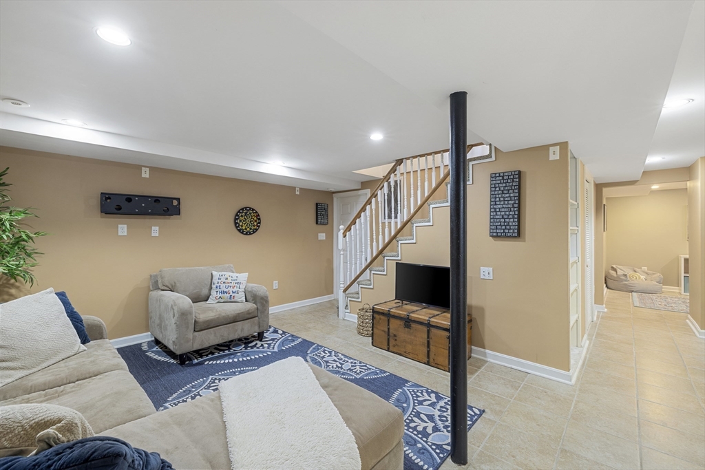 8 Hatch Road Medford, MA 02155 - Photo 33 of 42 a living room with furniture and a wooden floor