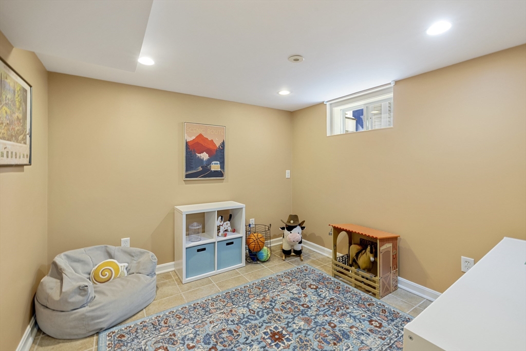 8 Hatch Road Medford, MA 02155 - Photo 34 of 42 a living room with furniture and a wooden floor