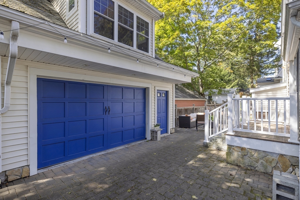 8 Hatch Road Medford, MA 02155 - Photo 37 of 42 a view of a house with a small yard and wooden fence