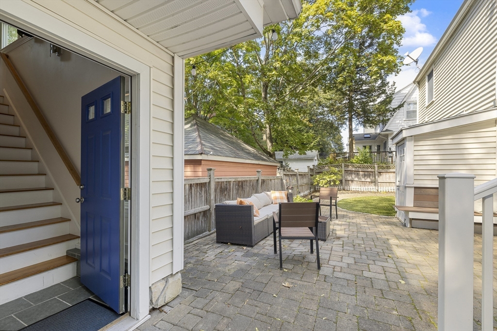 8 Hatch Road Medford, MA 02155 - Photo 38 of 42 a view of a patio with table and chairs and potted plants