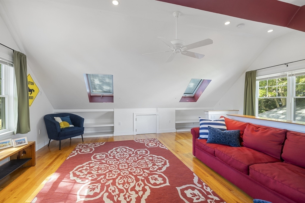 8 Hatch Road Medford, MA 02155 - Photo 39 of 42 a living room with furniture and a rug