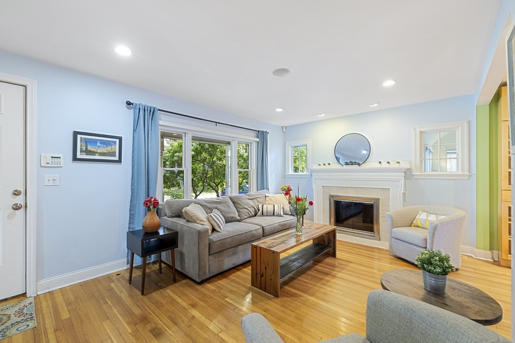 8 Hatch Road Medford, MA 02155 - Photo 9 of 42 a living room with furniture and a fireplace