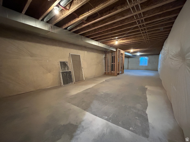 6 South 450th West Gunnison, UT 84634 - Photo 38 of 45 Expansive unfinished lower level featuring exposed ceiling joists, concrete flooring, and an egress window