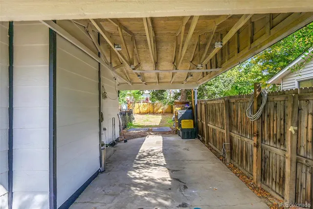 a view of a pathway door with wooden fence