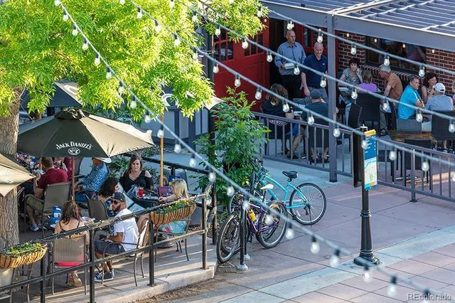 a view of street with seating area and trees