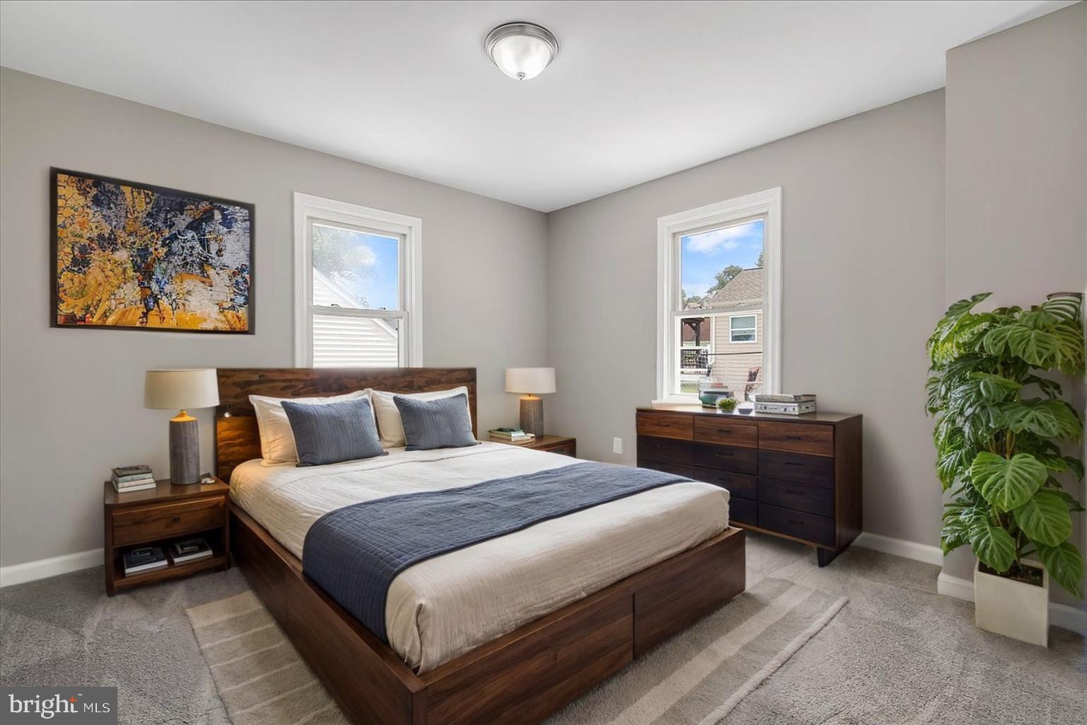 25 Mansion Road Linthicum Heights, MD 21090 - Photo 11 of 26 a bedroom with a bed and a potted plant