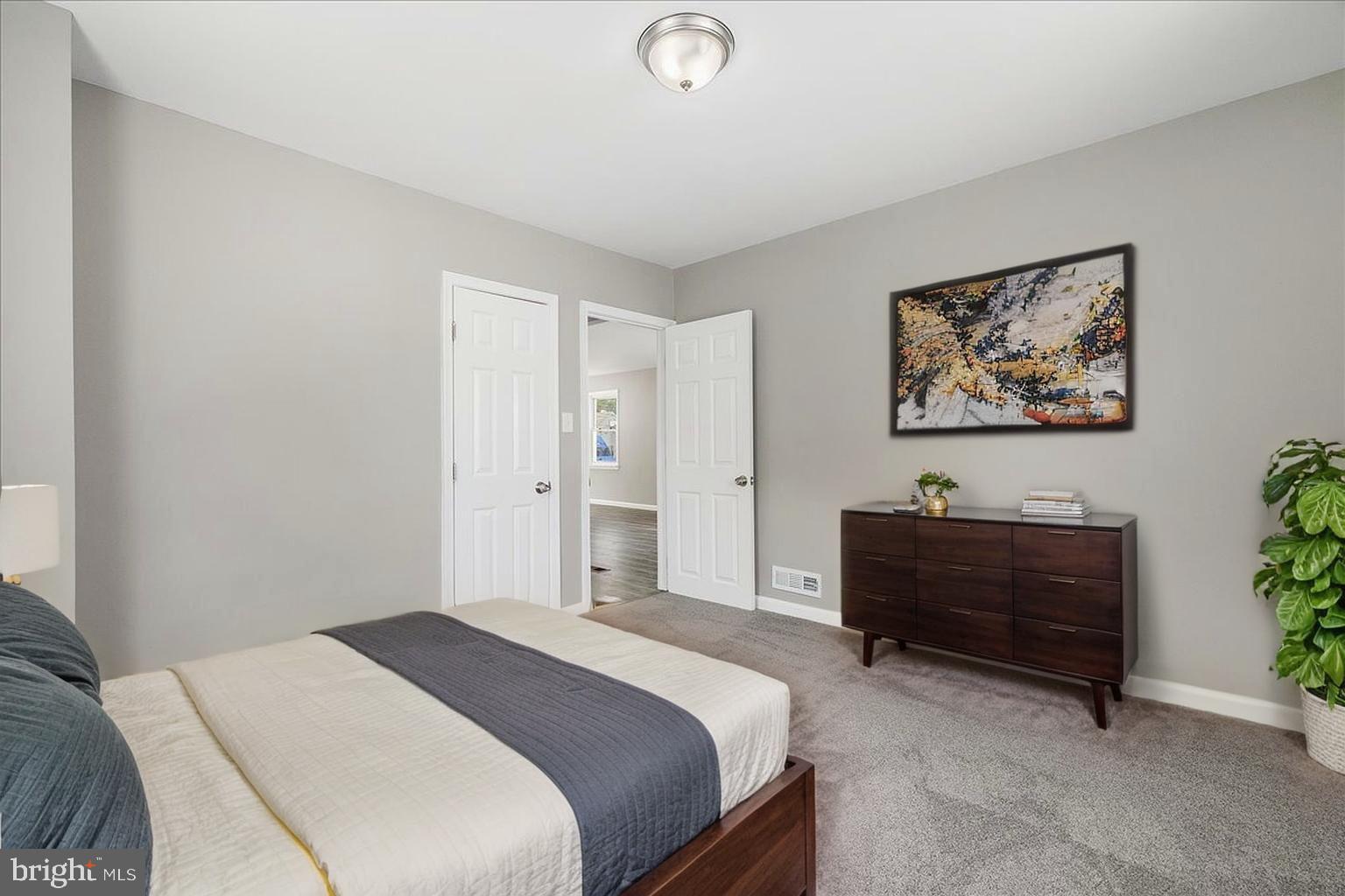 25 Mansion Road Linthicum Heights, MD 21090 - Photo 12 of 26 a bedroom with a bed and a dresser