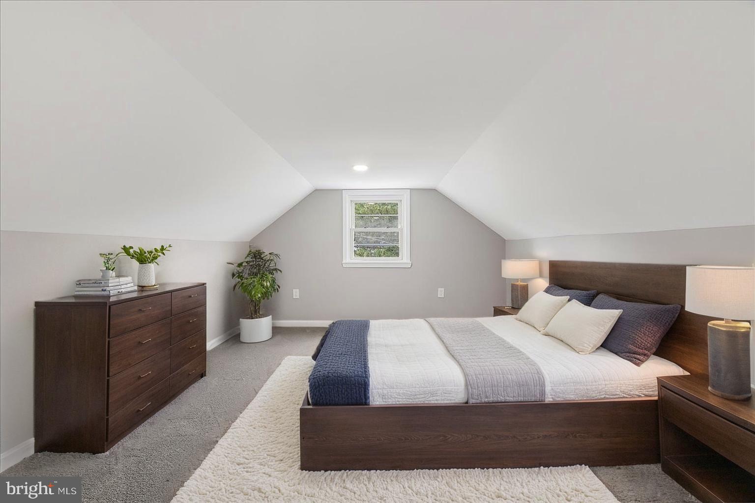 25 Mansion Road Linthicum Heights, MD 21090 - Photo 18 of 26 a bedroom with a large bed and a potted plant
