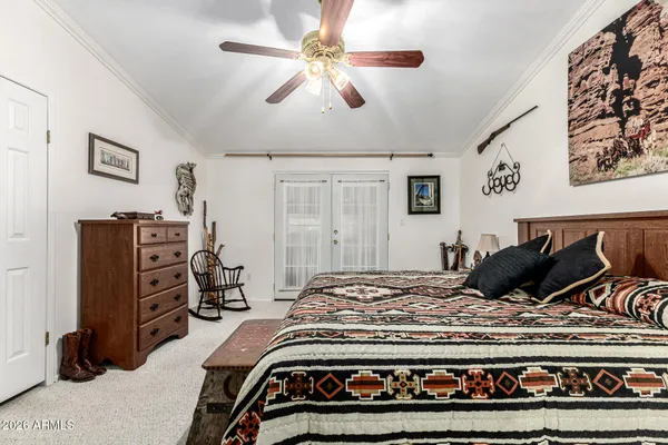 a spacious bathroom with a granite countertop sink and a mirror