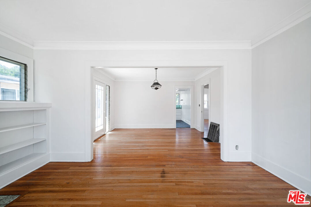 2346 Ridgeview Avenue Los Angeles, CA 90041 - Photo 2 of 22 a view of an empty room with wooden floor and a window