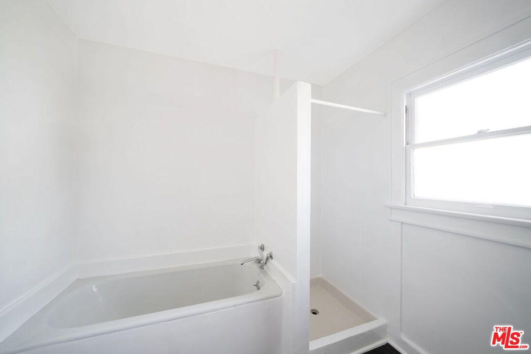 2346 Ridgeview Avenue Los Angeles, CA 90041 - Photo 11 of 22 a white bath tub sitting next to a window