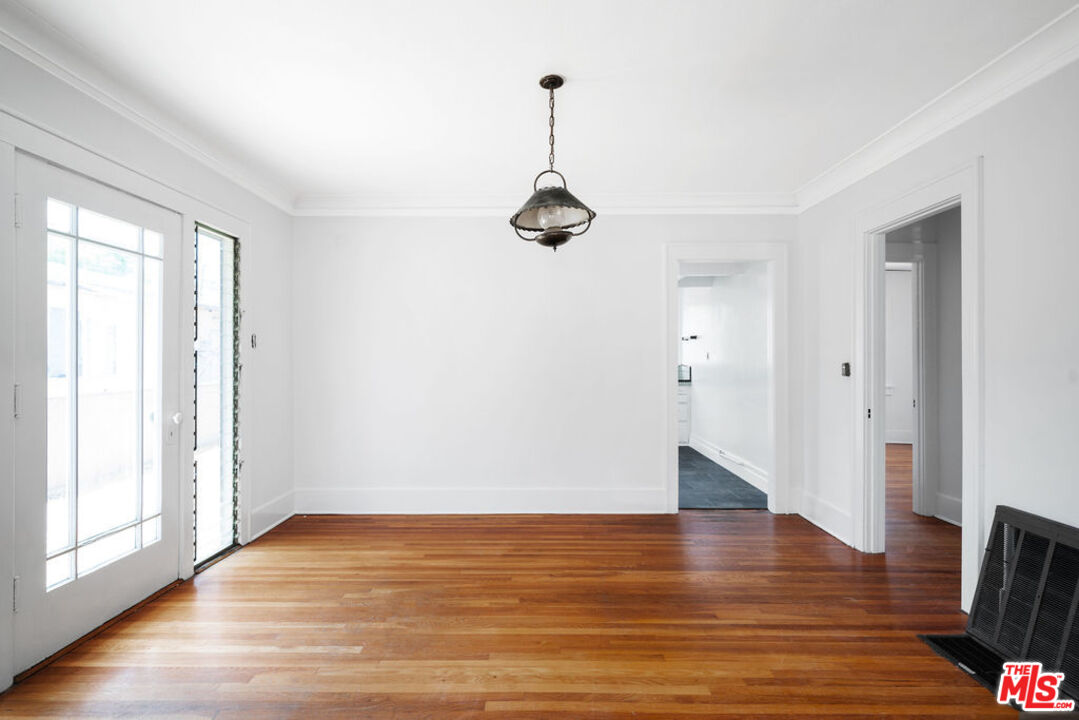 2346 Ridgeview Avenue Los Angeles, CA 90041 - Photo 4 of 22 an empty room with wooden floor and windows