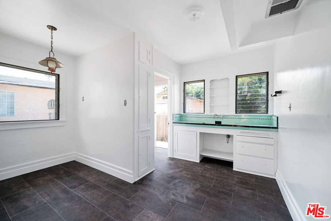 2346 Ridgeview Avenue Los Angeles, CA 90041 - Photo 7 of 22 a room with a sink and chandelier