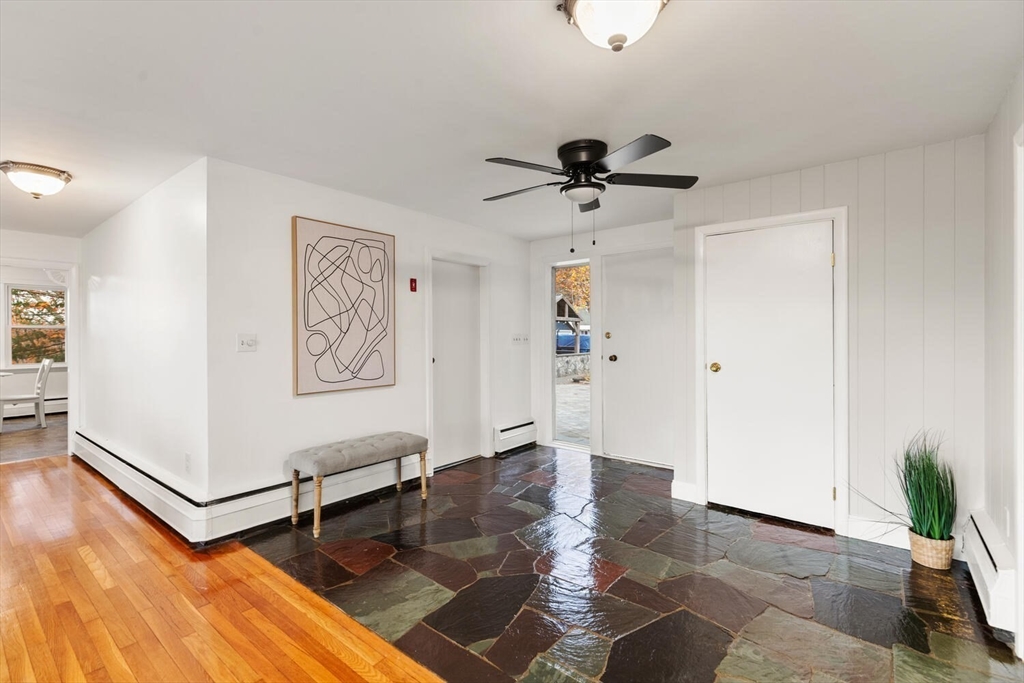 2 McIntyre Road Saugus, MA 01906 - Photo 11 of 42 a view of a livingroom with a furniture a ceiling fan and wooden floor