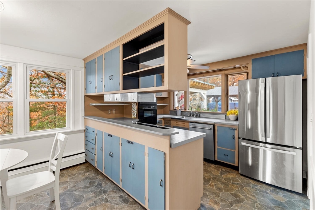 2 McIntyre Road Saugus, MA 01906 - Photo 16 of 42 a kitchen with stainless steel appliances a refrigerator sink and microwave