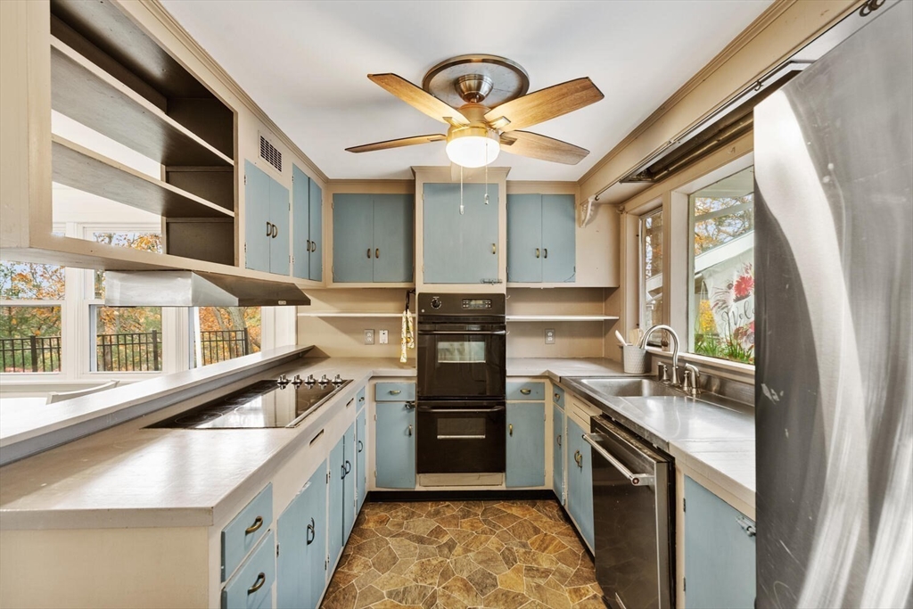 2 McIntyre Road Saugus, MA 01906 - Photo 20 of 42 a kitchen with stainless steel appliances granite countertop a stove and a refrigerator