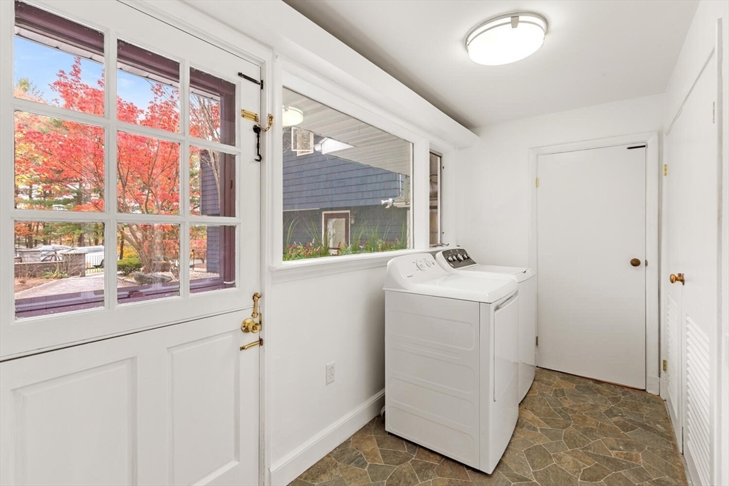 2 McIntyre Road Saugus, MA 01906 - Photo 21 of 42 a bathroom with a sink and mirror with shower