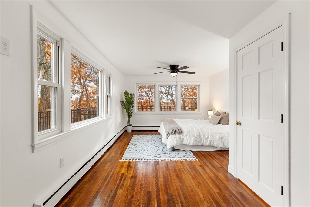 2 McIntyre Road Saugus, MA 01906 - Photo 22 of 42 a spacious bedroom with a bed and wooden floor