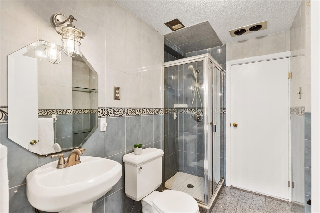 2 McIntyre Road Saugus, MA 01906 - Photo 24 of 42 a bathroom with a sink toilet and shower